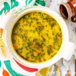 A Dutch oven filled with Polish potato dill soup.